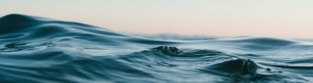 body of water under sky