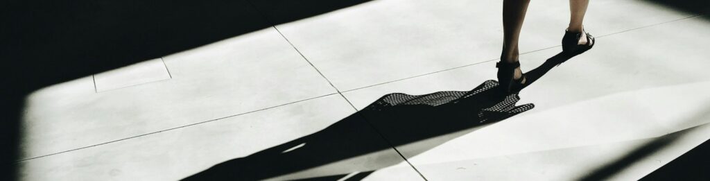 woman walking with shadow