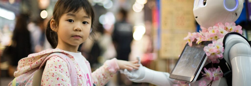 photo of girl laying left hand on white digital robot