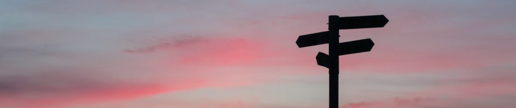 silhouette of road signage during golden hour