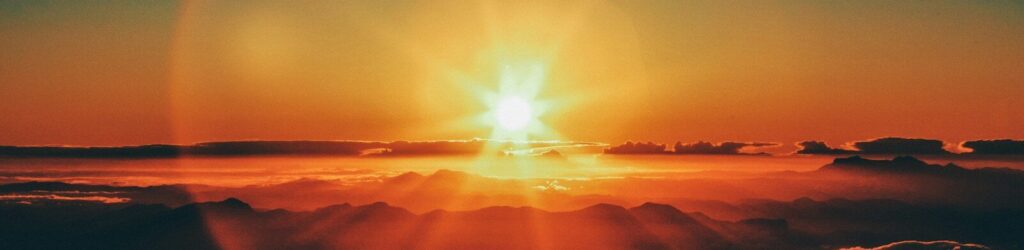 calm body of water during sunset