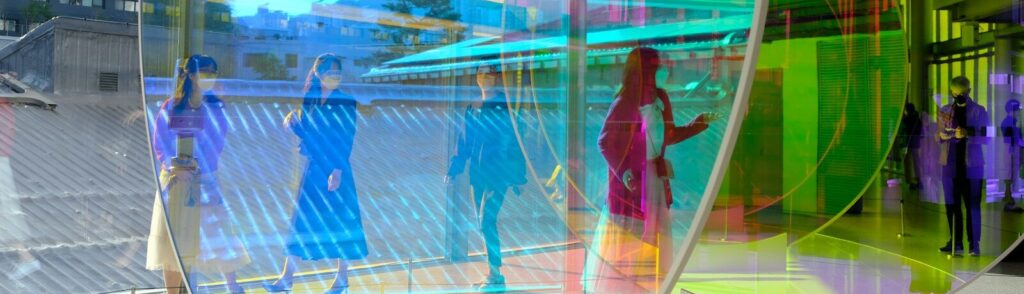 a group of people standing inside of a building