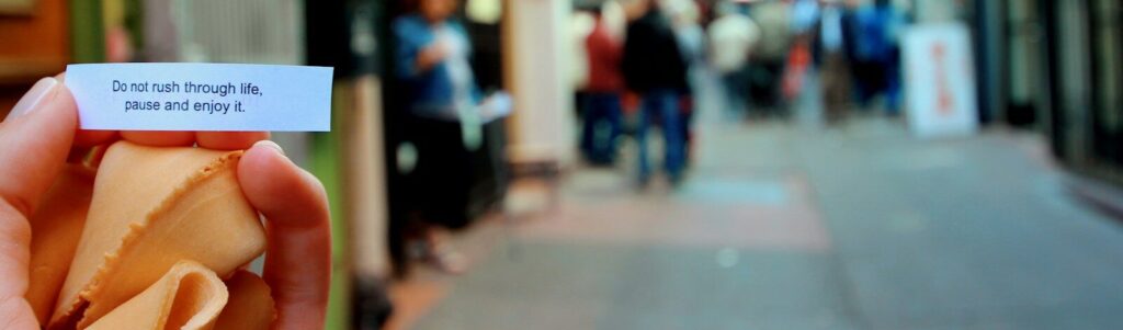 person holding white and red card