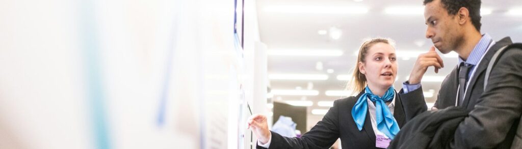 man and woman talking near the wall