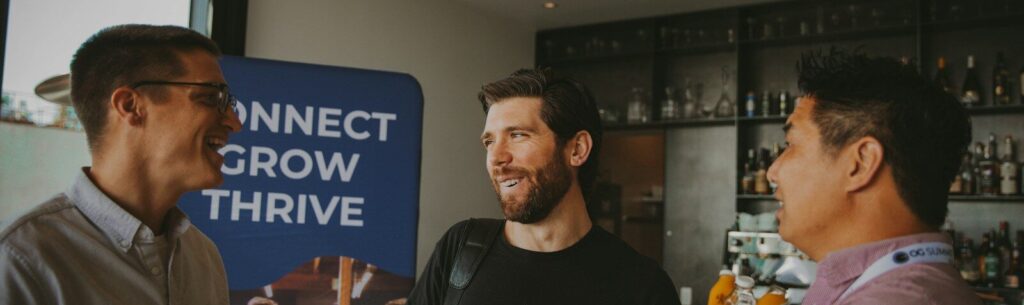 a group of three men standing next to each other