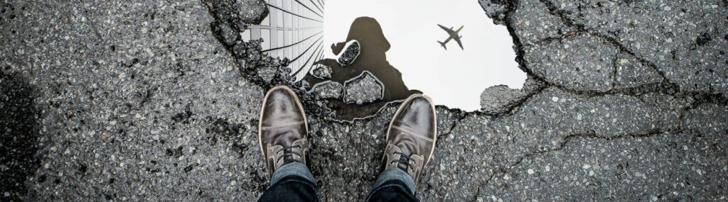 person standing in front of body of water