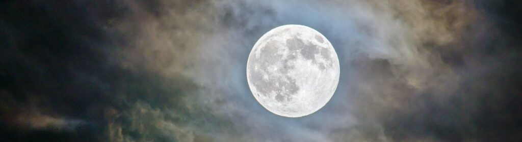 full moon and gray clouds during nighttime