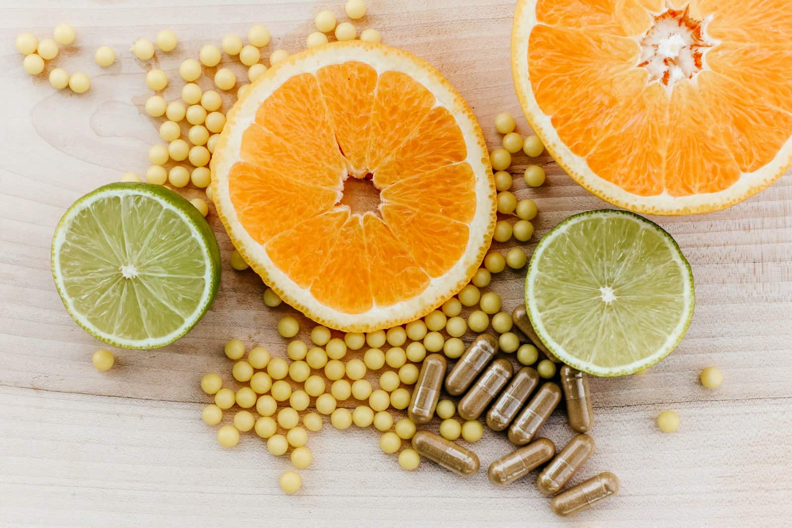 oranges, peas, and limes on a wooden table, Natural Supplements