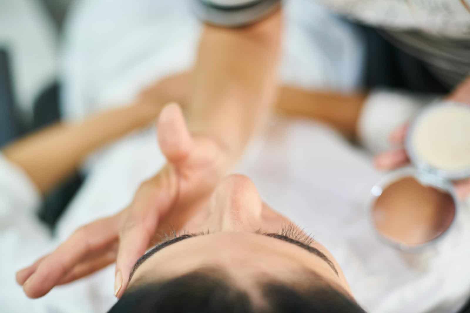 functional medicine, holistic health, digestion, indigestion, stomach problems, supplements, nutrition, health, , Close-up view of a professional makeup artist applying cosmetics indoors, highlighting beauty and skin care.