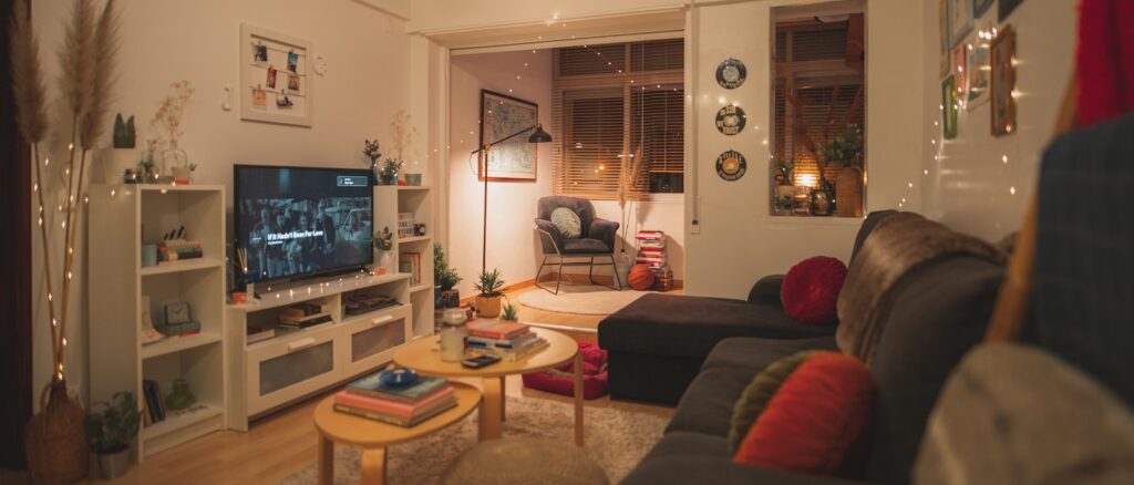 a living room filled with furniture and a flat screen tv