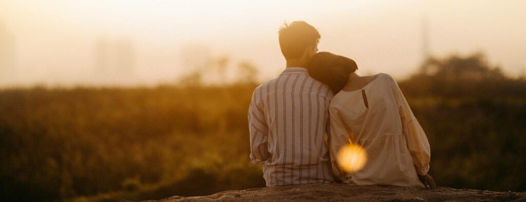 A couple enjoys a serene moment together during a sunset in Gia Lai, Vietnam.