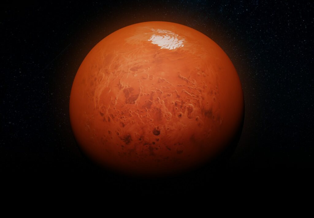 a red planet with a star in the background