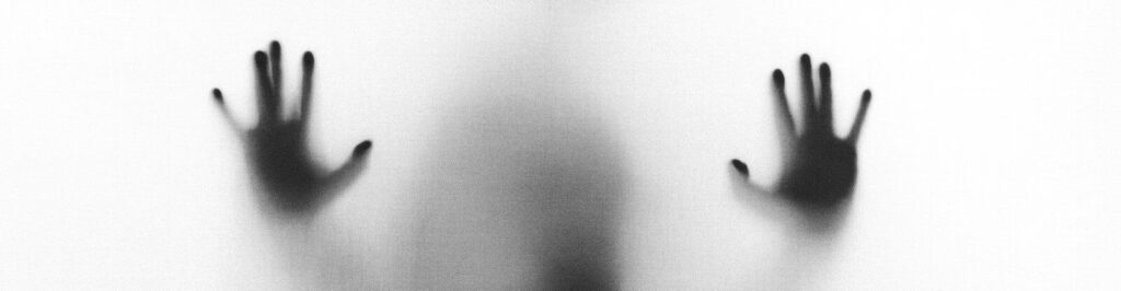 person behind fog glass